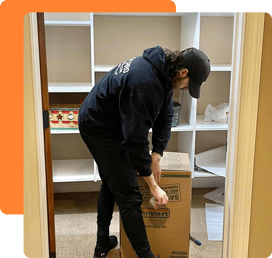 MovePro mover carefully packing furniture inside a home during a residential move in Fort Wayne