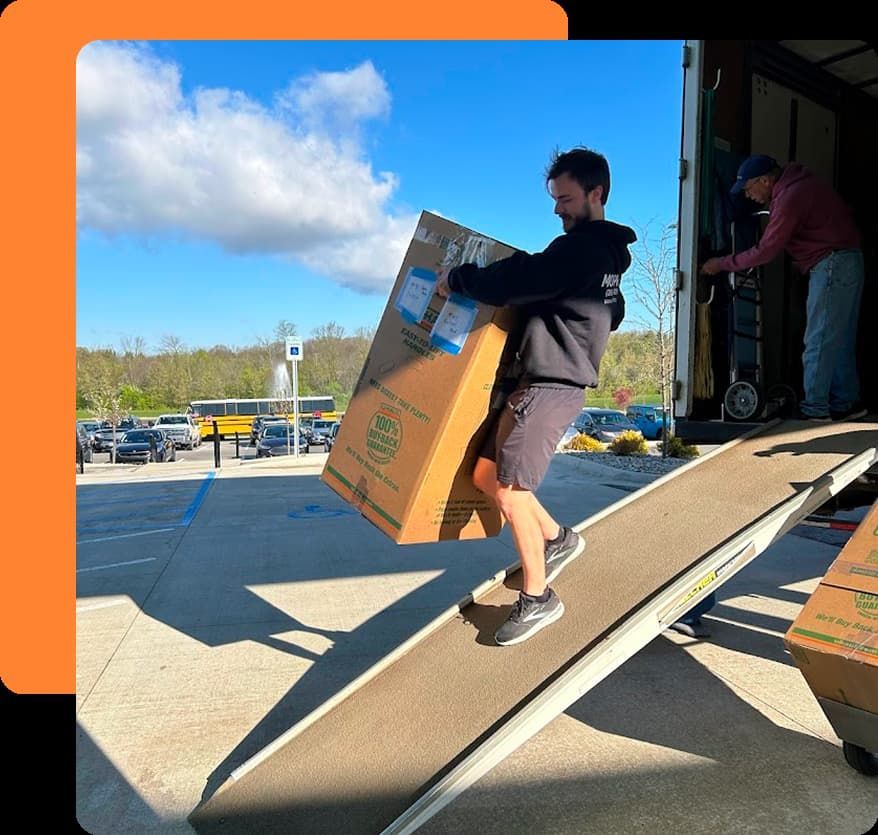 MovePro movers carrying boxes into a home during a residential move in Fort Wayne