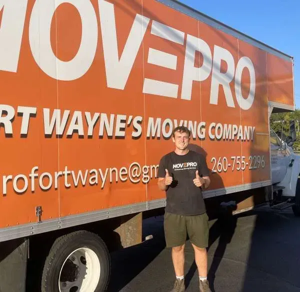 MovePro team member organizing supplies in warehouse for efficient moving services