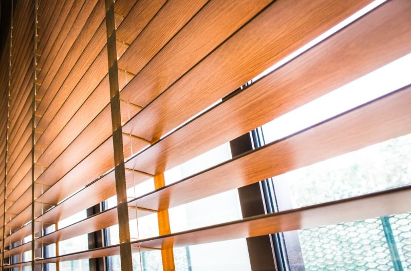 A Close Up of a Window With Wooden Blinds on It — BTS Blinds & Awnings in Moree, NSW