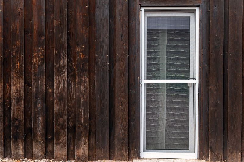 There is a Window on the Side of a Wooden Building — BTS Blinds & Awnings in Scone, NSW