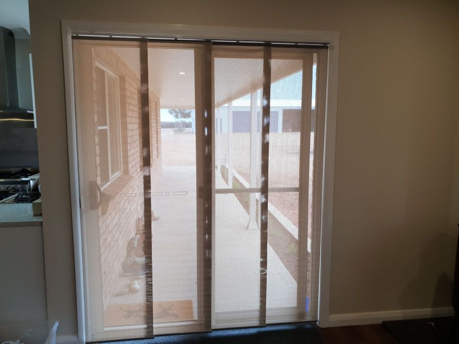 A Sliding Glass Door With a Screen on It — BTS Blinds & Awnings in Gunnedah, NSW