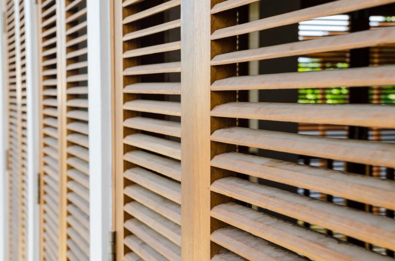 A Close Up of Wooden Shutters on a Window — BTS Blinds & Awnings in Tamworth, NSW