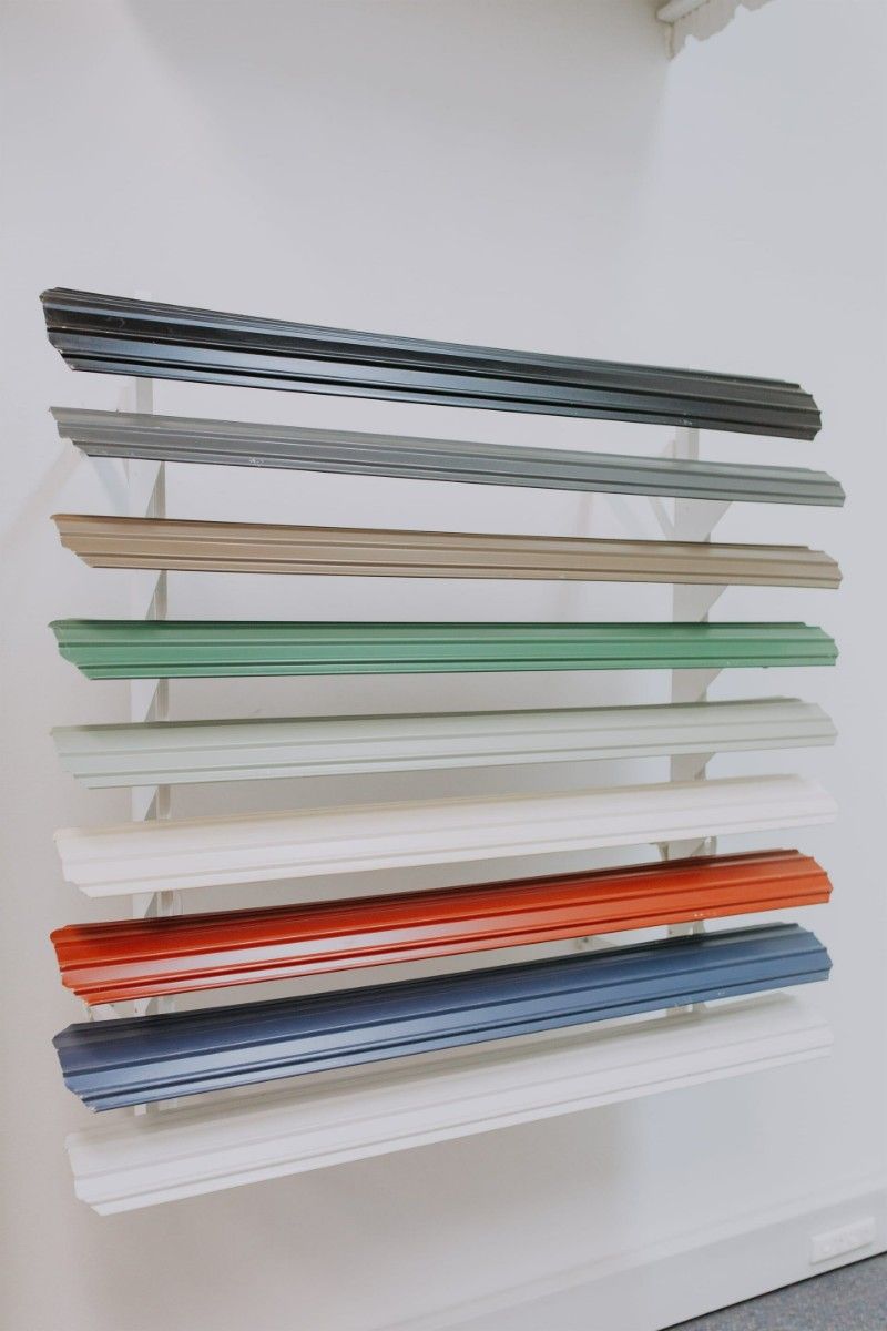 A Row of Shelves With Different Colors on Them — BTS Blinds & Awnings in Gunnedah, NSW