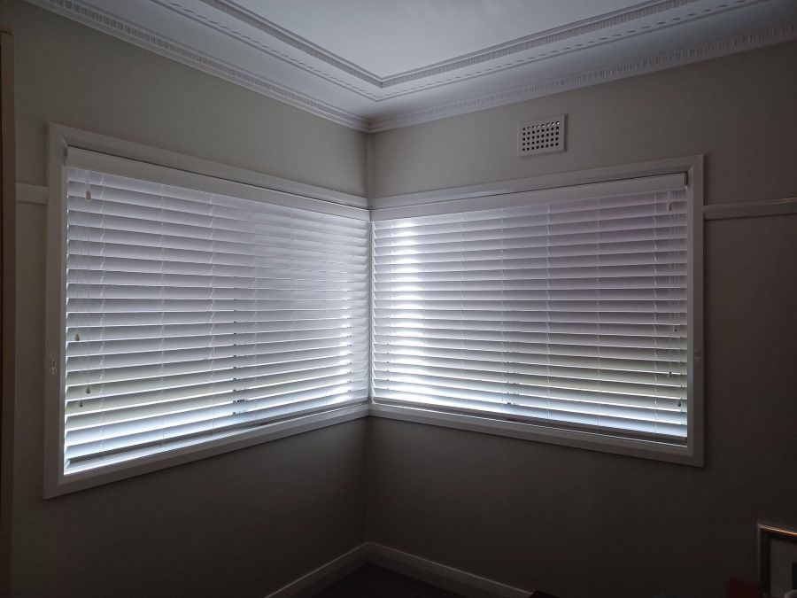 There Are Two Windows in the Corner of the Room With Blinds on Them — BTS Blinds & Awnings in Gunnedah, NSW