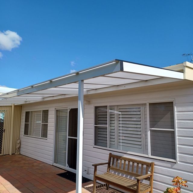A White House With a Bench Under a Canopy — BTS Blinds & Awnings in Gunnedah, NSW