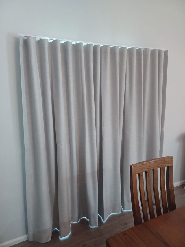 A Dining Room With a Table and Chairs and Curtains on the Window — BTS Blinds & Awnings in Gunnedah, NSW