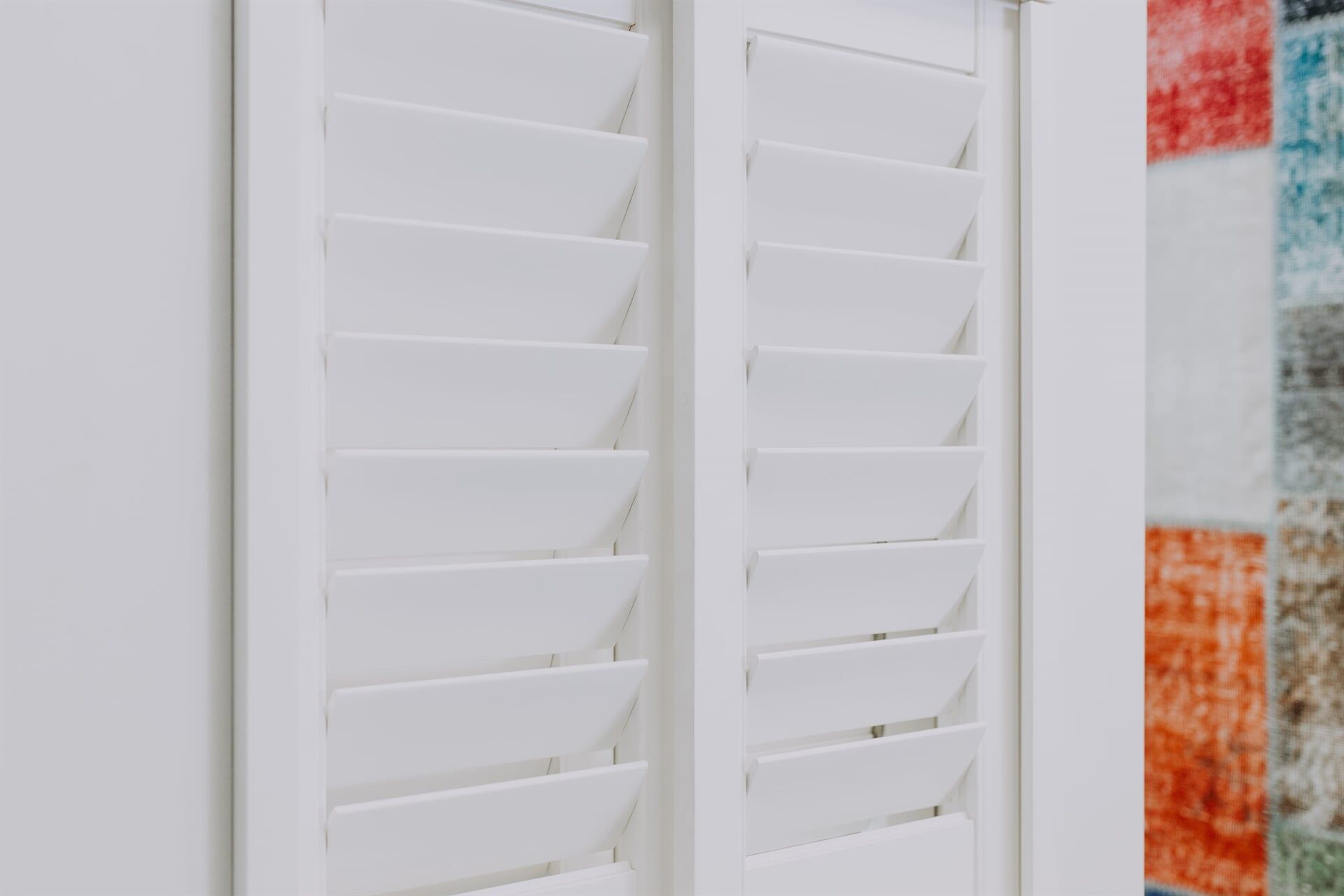 A Close Up of a White Window With Shutters on It — BTS Blinds & Awnings in Gunnedah, NSW