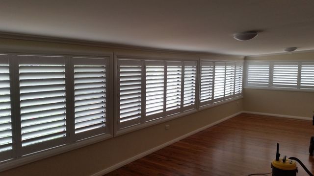 A Long Hallway With White Shutters on the Windows — BTS Blinds & Awnings in Gunnedah, NSW