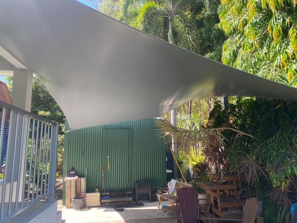 Gray Shade Sail Over a Patio — Professional Shade Sail Installation in Noosa, QLD