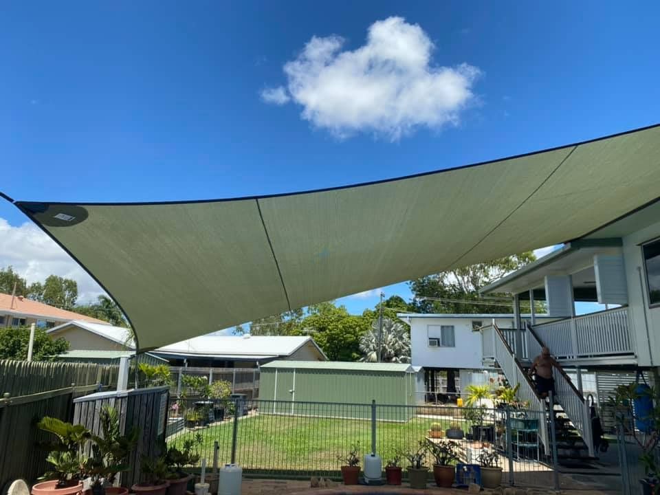 Beige Shade Sail Over a Backyard — Professional Shade Sail Installation in Maroochydore, QLD