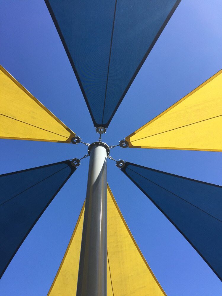 Blue and Yellow Shade Sails — Professional Shade Sail Installation in Caloundra, QLD