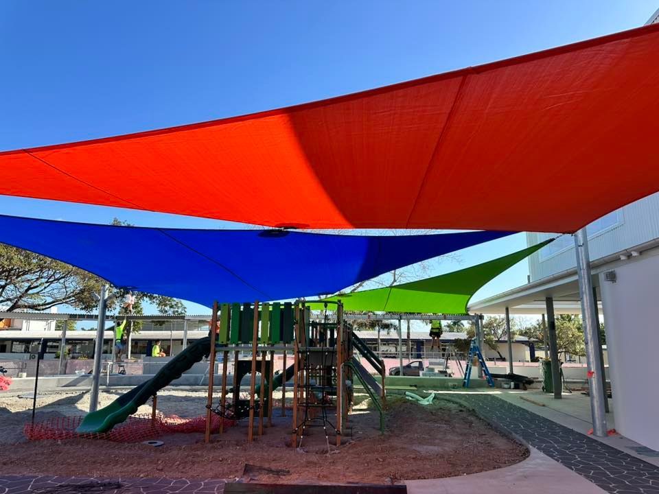 Colorful Shade Sails Over Outdoor Area — Professional Shade Sail Installation in Mooloolaba, QLD