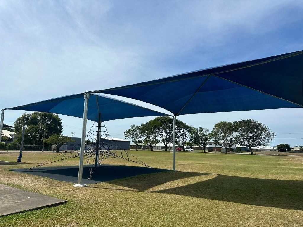 Blue Shade Structure Over Field — Professional Shade Sail Installation in Noosa, QLD