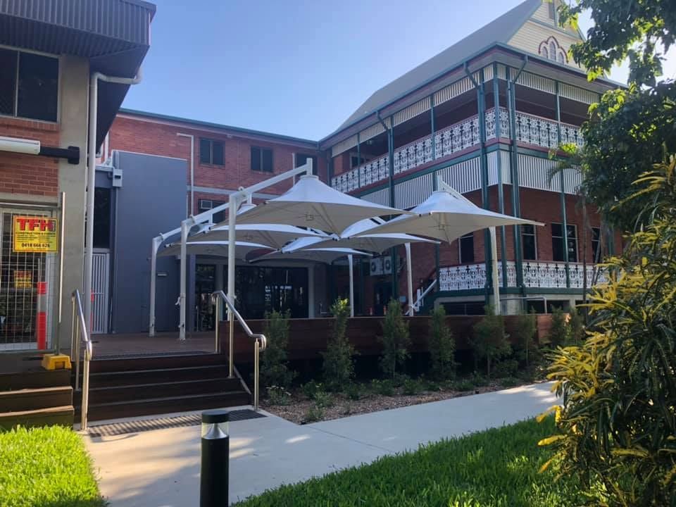 Shade Umbrellas Outside Building — Professional Shade Sail Installation in Caloundra, QLD