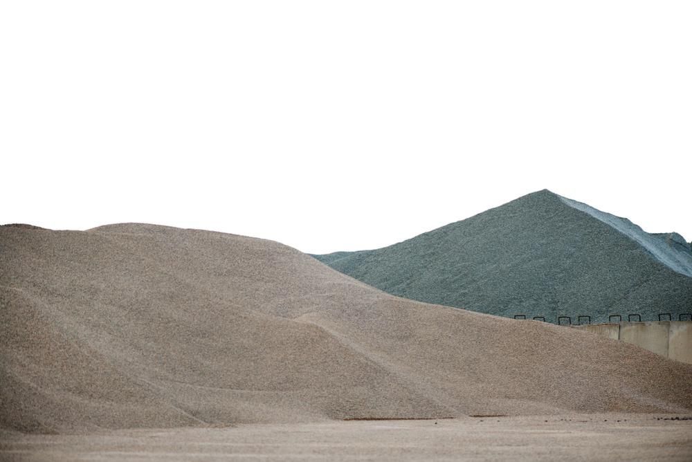 A Large Pile of Dirt is Sitting in the Middle of a Field — Chooks Sand And Gravel In Paget, QLD
