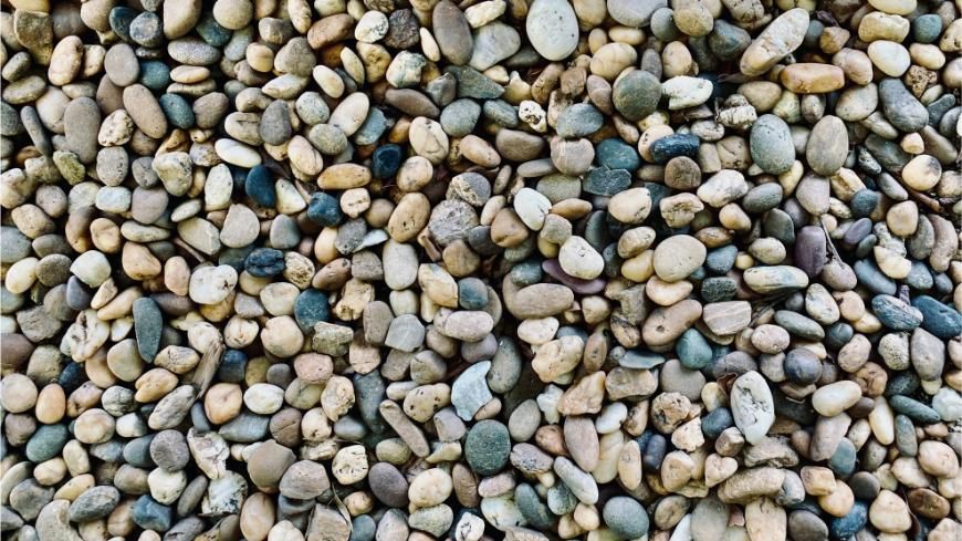 Pile of Smooth, Multicolored River Rocks — Chooks Sand And Gravel In Paget, QLD
