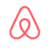 Red Airbnb logo icon on a white background