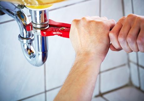 Plumber Fixing A Sink — Sergeant Bluff, IA — Speedy Rooter Plumbing Plumber Fixing A Sink — Sergeant Bluff, IA — Speedy Rooter Plumbing