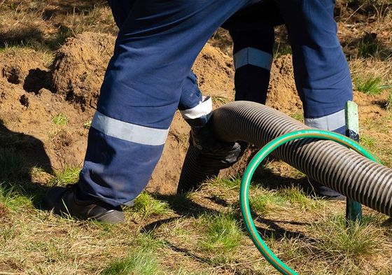 Worker Providing Sewer Cleaning Service — Sergeant Bluff, IA — Speedy Rooter Plumbing Worker Providing Sewer Cleaning Service — Sergeant Bluff, IA — Speedy Rooter Plumbing