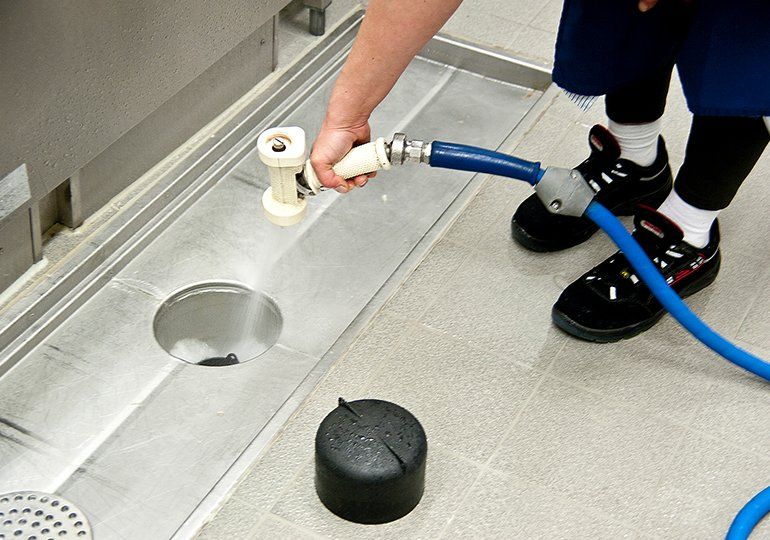 Cleaning Floor Drain In The Kitchen — Sergeant Bluff, IA — Speedy Rooter Plumbing Cleaning Floor Drain In The Kitchen — Sergeant Bluff, IA — Speedy Rooter Plumbing