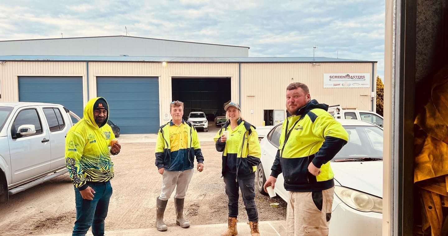 A Group Of People Standing Outside A Building — Bathurst, NSW — Beecham Concreting
