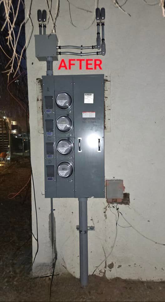 New electrical meter panel mounted on a wall at night, labeled “AFTER.”