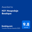 Premio Booking.com Traveller Review para H21 Hospedaje Boutique: un cuadrado azul con una calificación de 9,8 sobre 10.