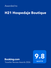 Premio Booking.com Traveller Review para H21 Hospedaje Boutique: un cuadrado azul con una calificación de 9,8 sobre 10.