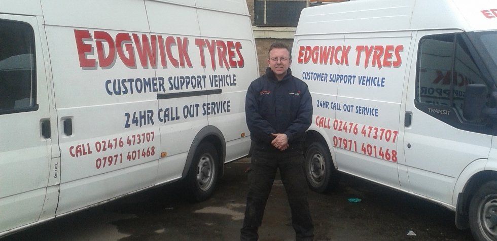 Tim with the company vans
