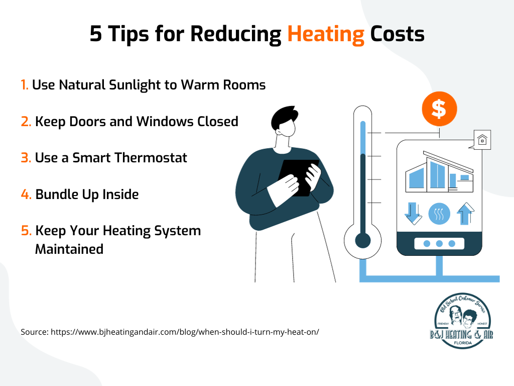 A man is standing next to a smart thermostat and a thermometer.