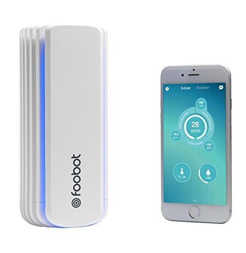 A remote control is sitting next to a cell phone.