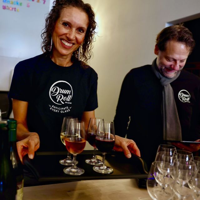 woman serving wine at winery