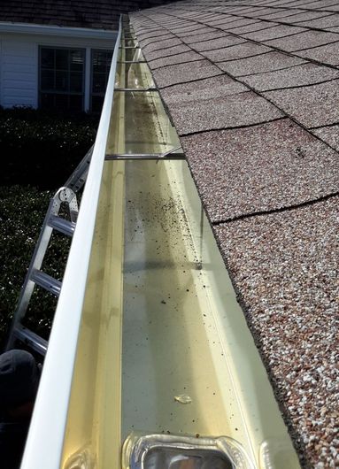 Professional gutter installer preparing the gutter