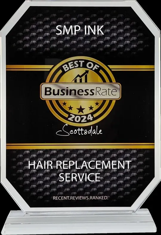 BusinessRate award sign for SMP Ink hair replacement service, black with gold accents, Scotland logo