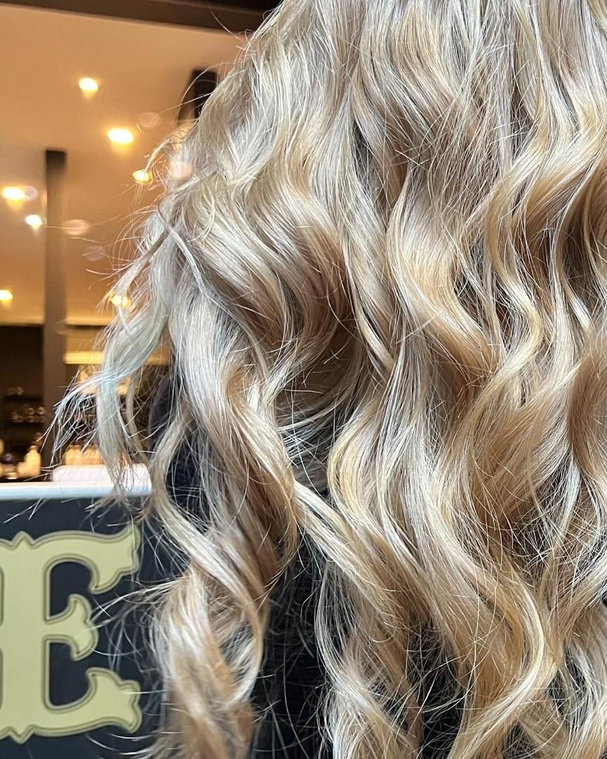A Close Up of a Woman 's Hair With a Sign in the Background — Energy Hair Co in Noosa Heads, QLD