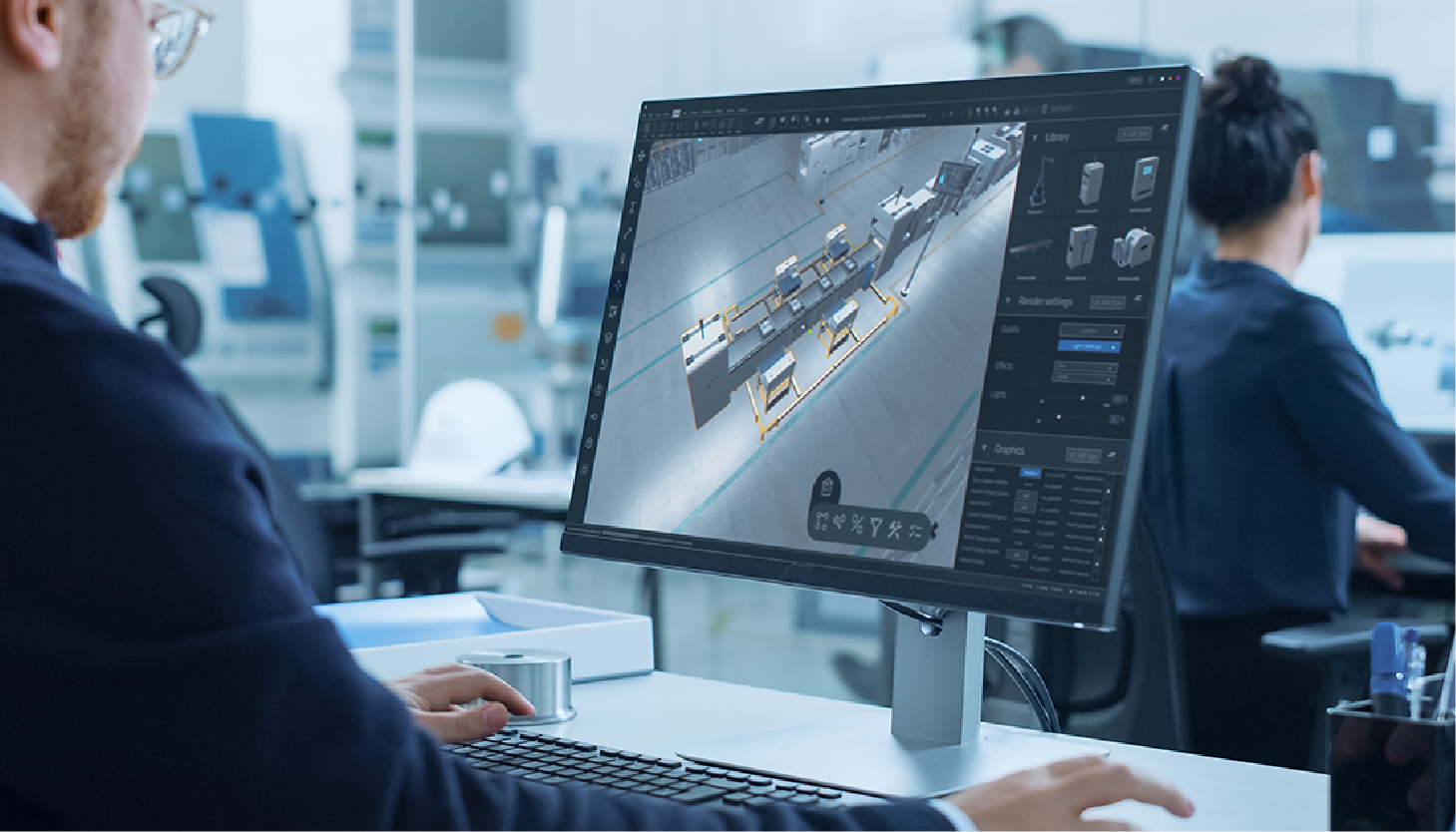 Person in suit working at a computer in a modern office, reviewing a 3D rendering.