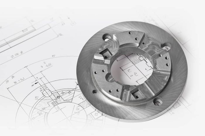 A metal disc with blueprints on it