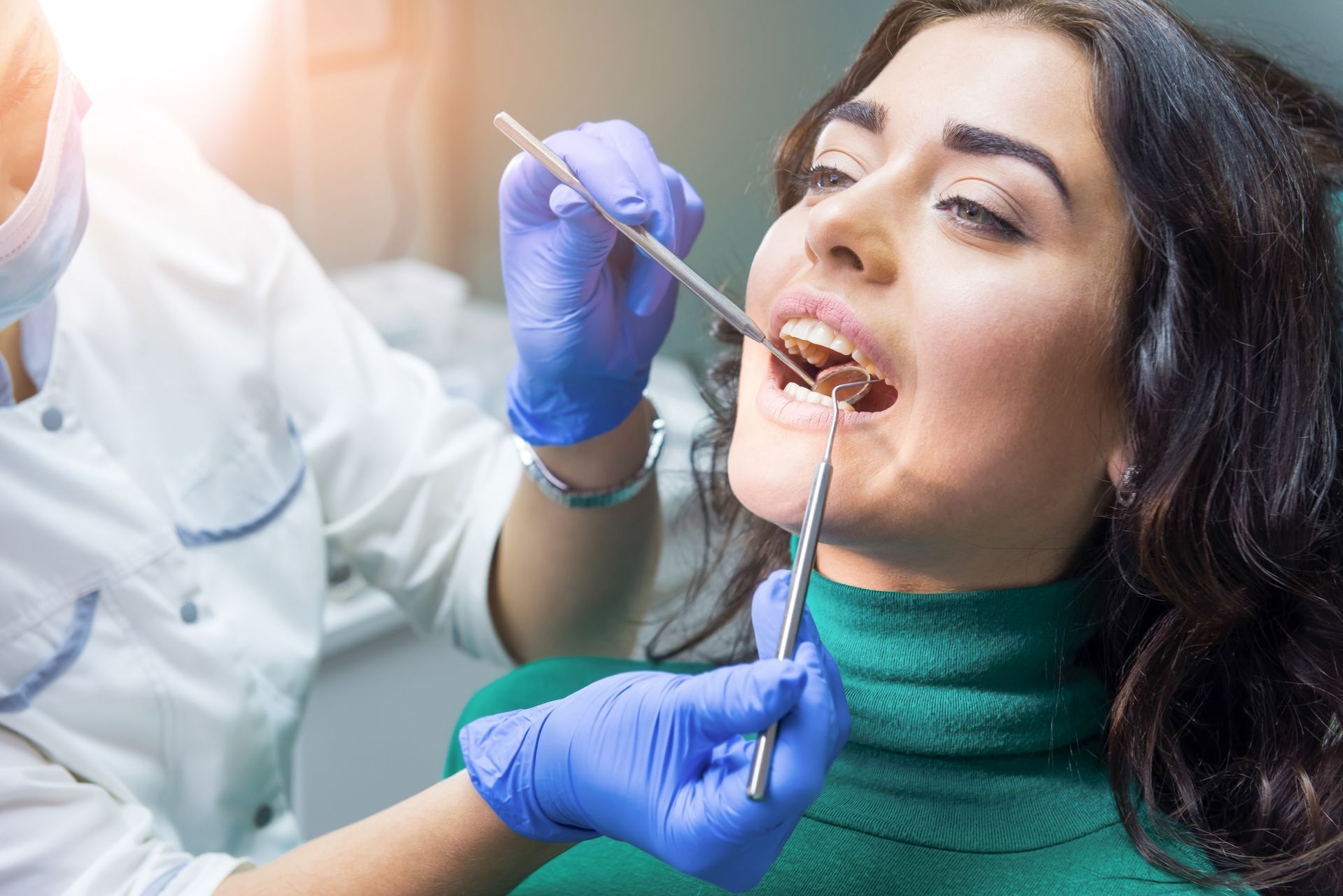 Close-up of the hands of a dentist at work. Close-up of the hands of a dentist at work.