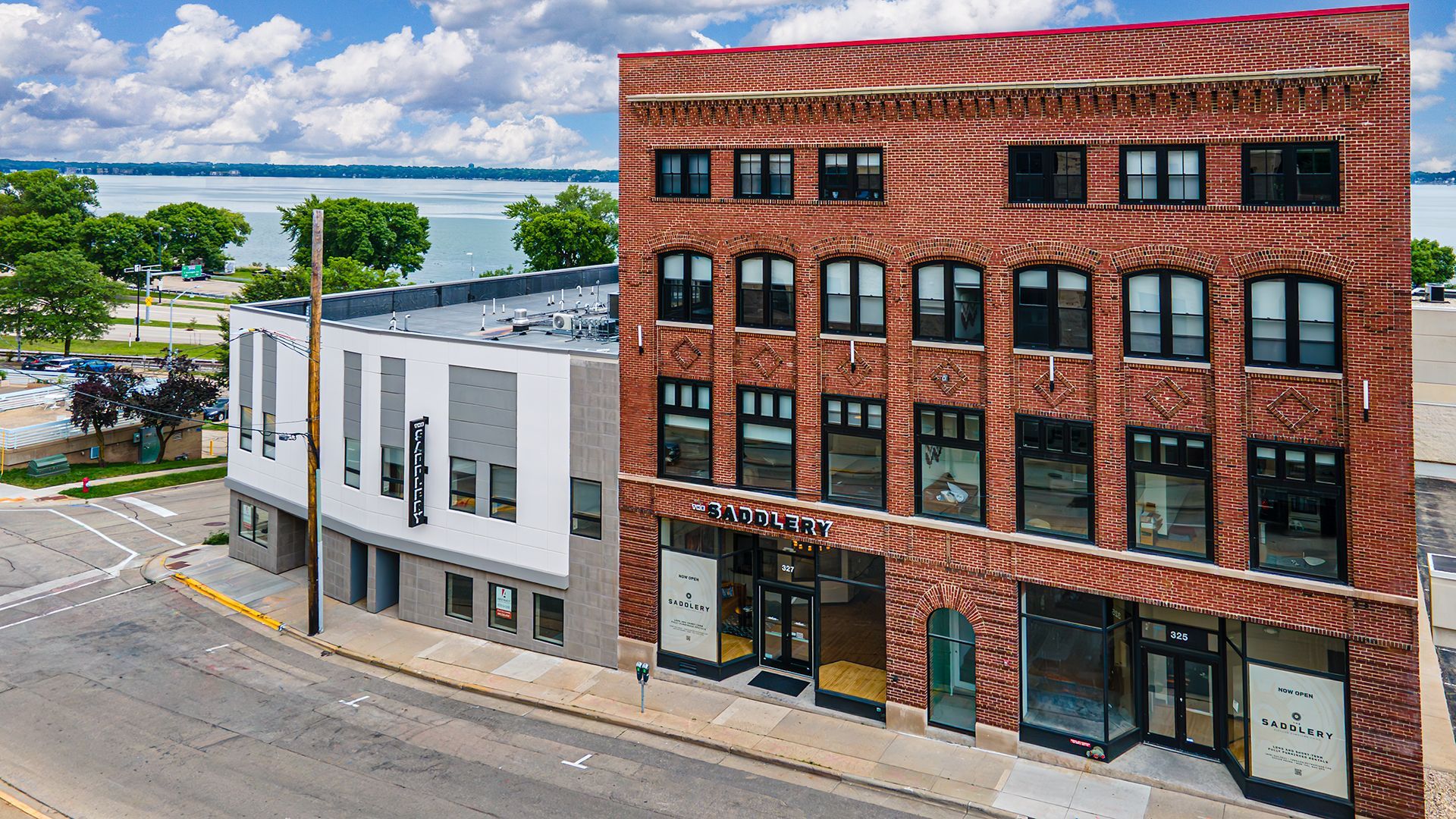 Photo of outside of The Saddlery Madison with lake in background