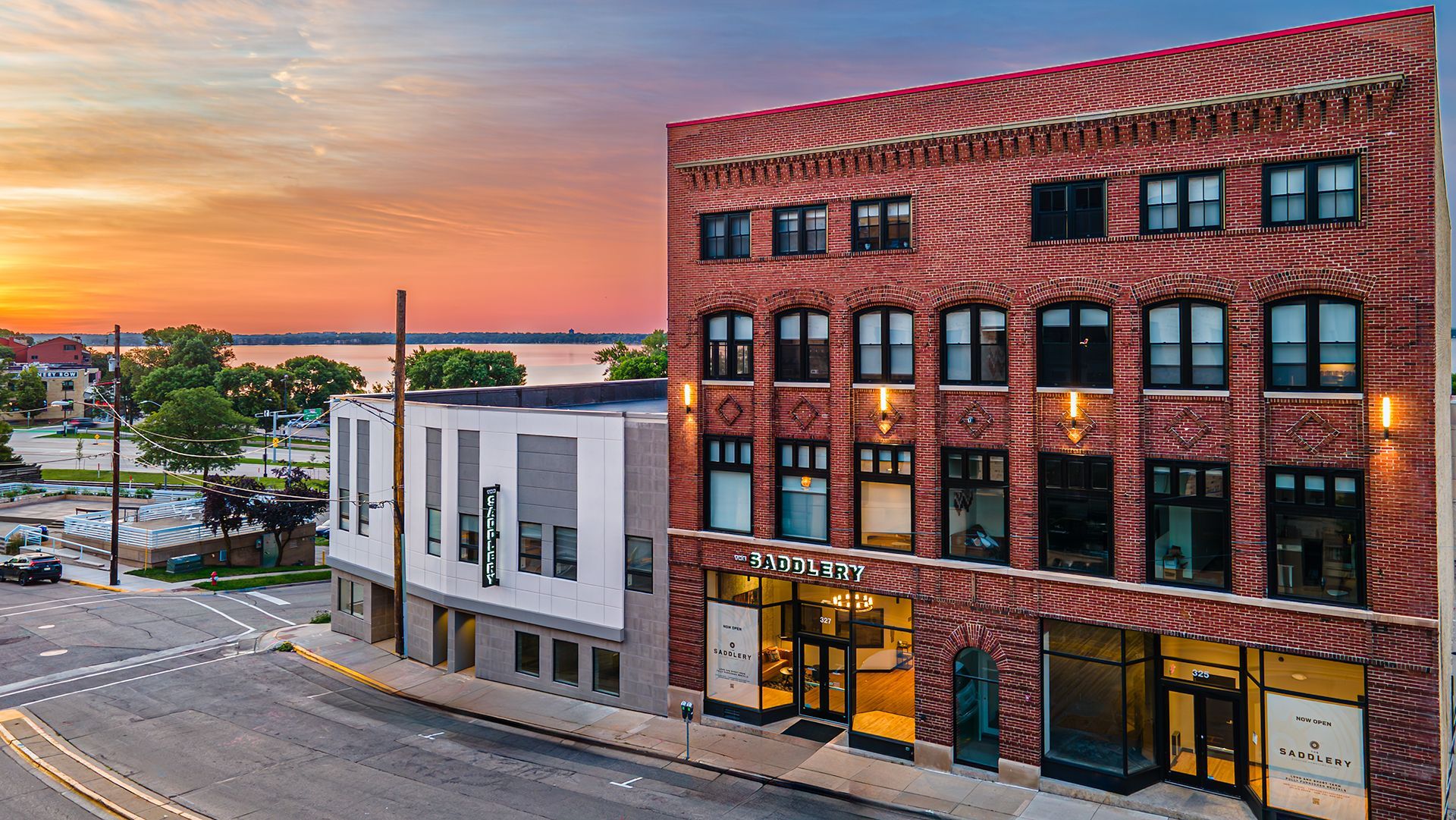 Photo of outside of The Saddlery Madison with lake in background