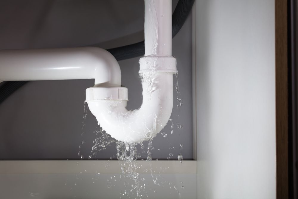 Leaking White Pipe Under a Sink