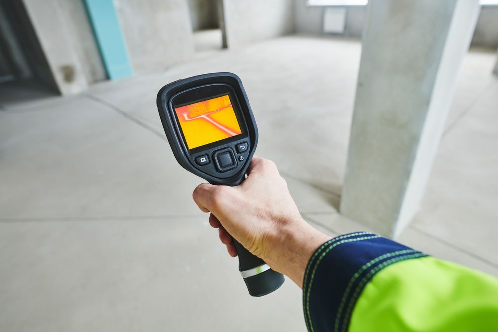 Person Using Leak Detection Device