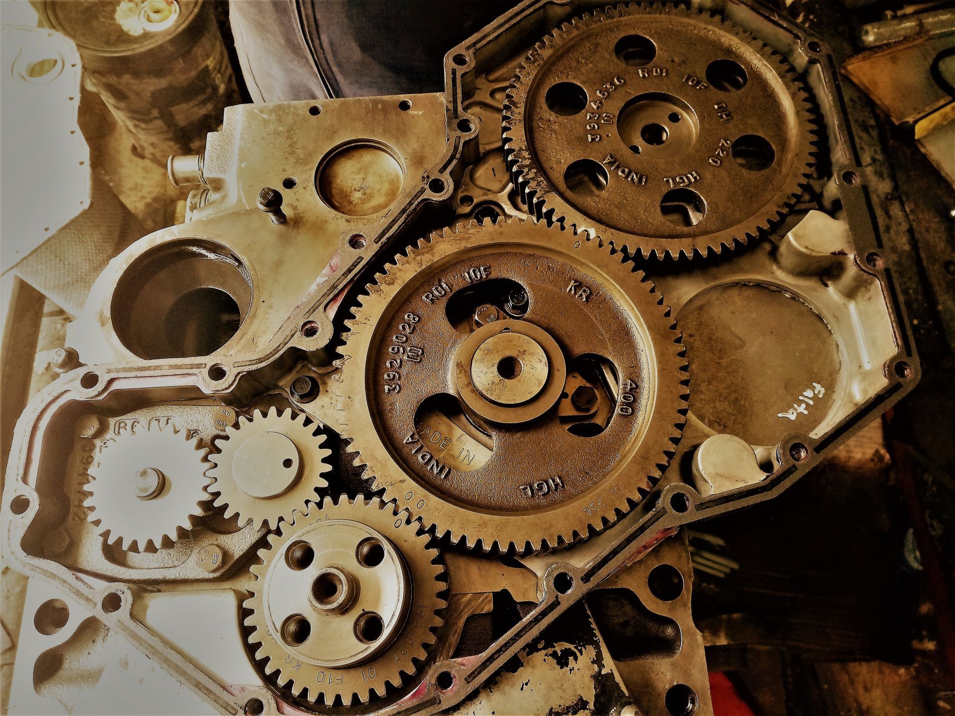 Close-up of exposed metal gears and engine components inside a mechanical housing.
