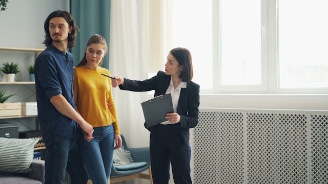 a landlord speaking with two potential tenants