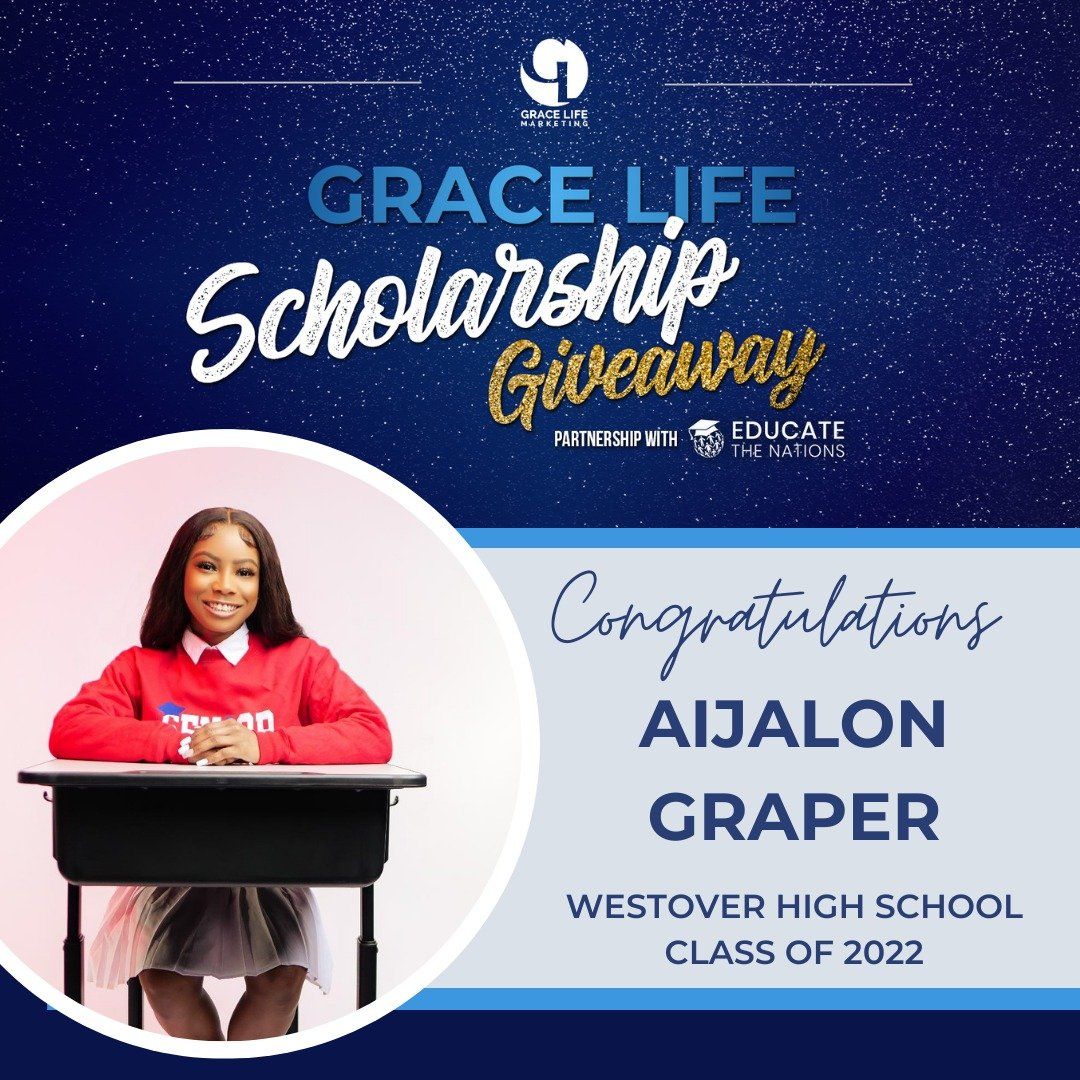 a girl is sitting at a desk in front of a sign that says grace life scholarship giveaway
