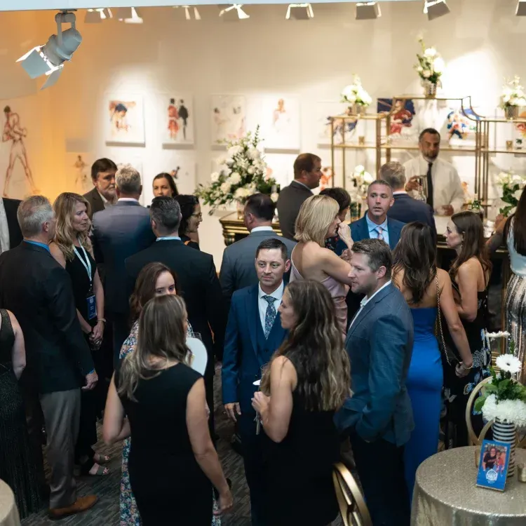 A Large Group Of People Are Gathered In A Room — Louisville, KY — Certe Management