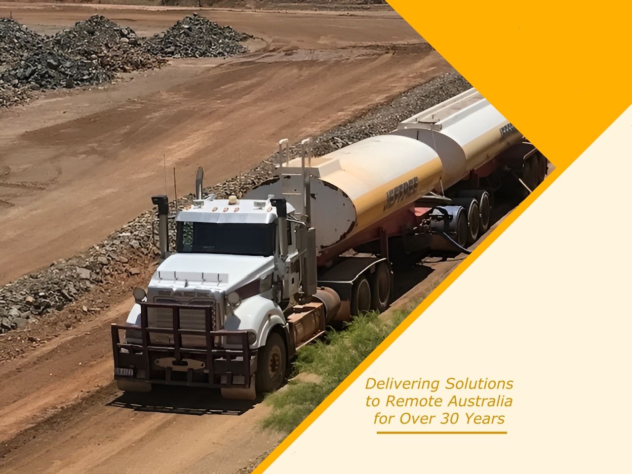 Water tanker truck on a dirt road in an industrial setting, possibly a mine— Ts Jeffree Contractors in Cloncurry, QLD