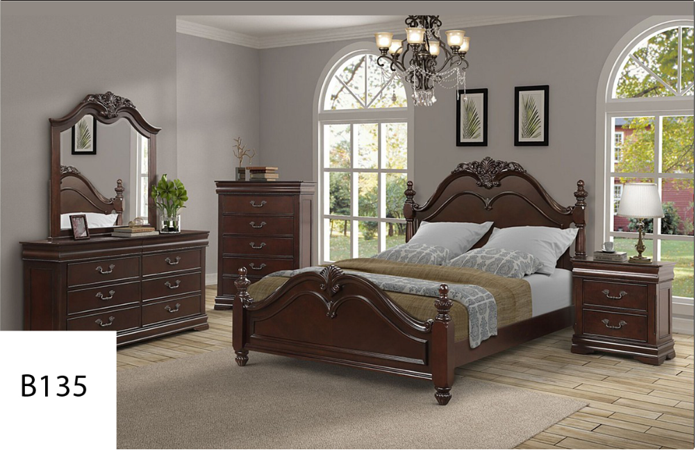 A bedroom with a bed dresser mirror and nightstand