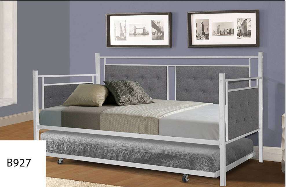 A day bed with a pull out bed underneath it